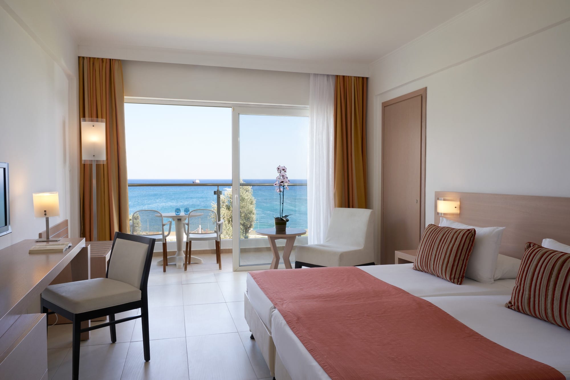 a bedroom with a large window