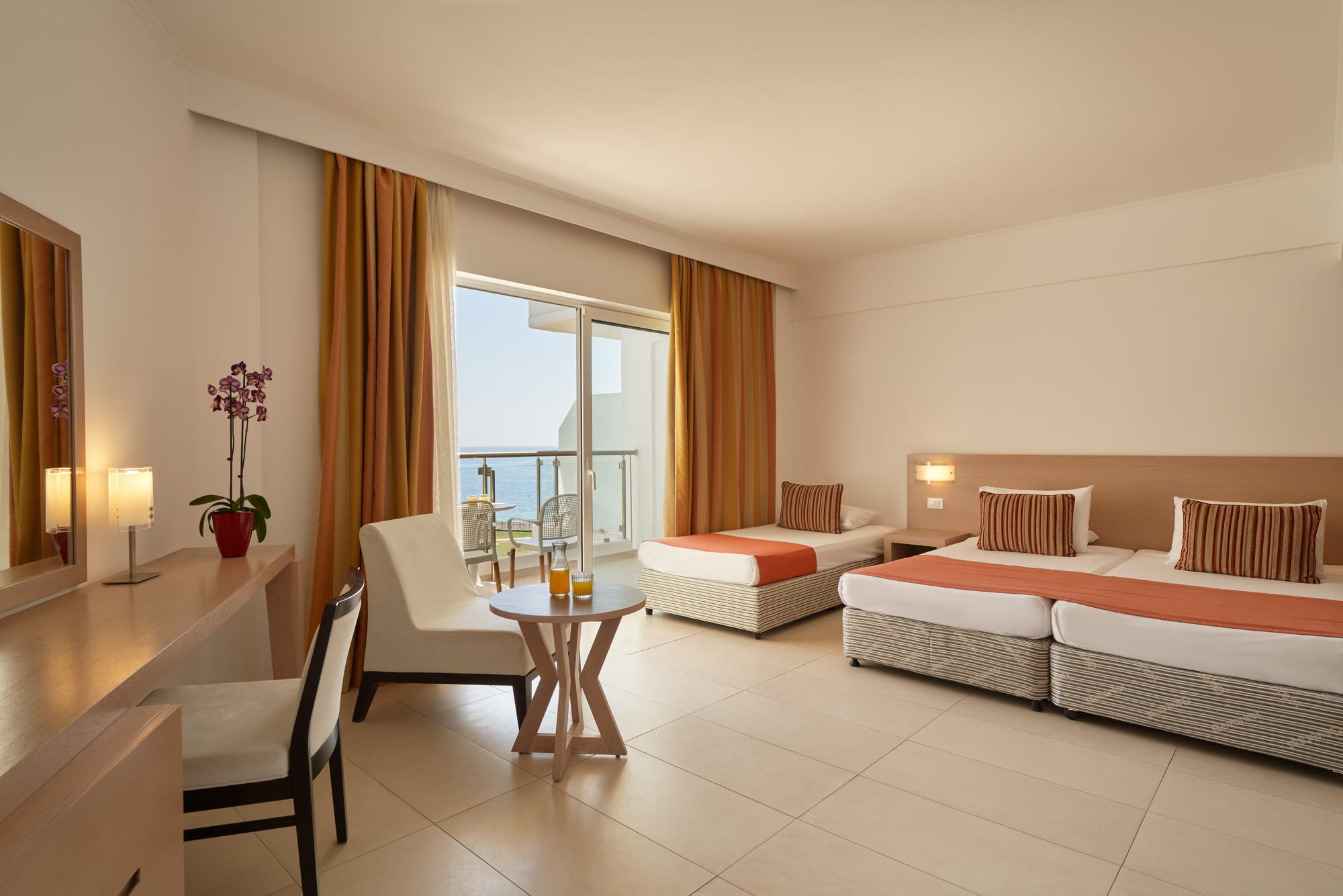 a large room with a bed and couches