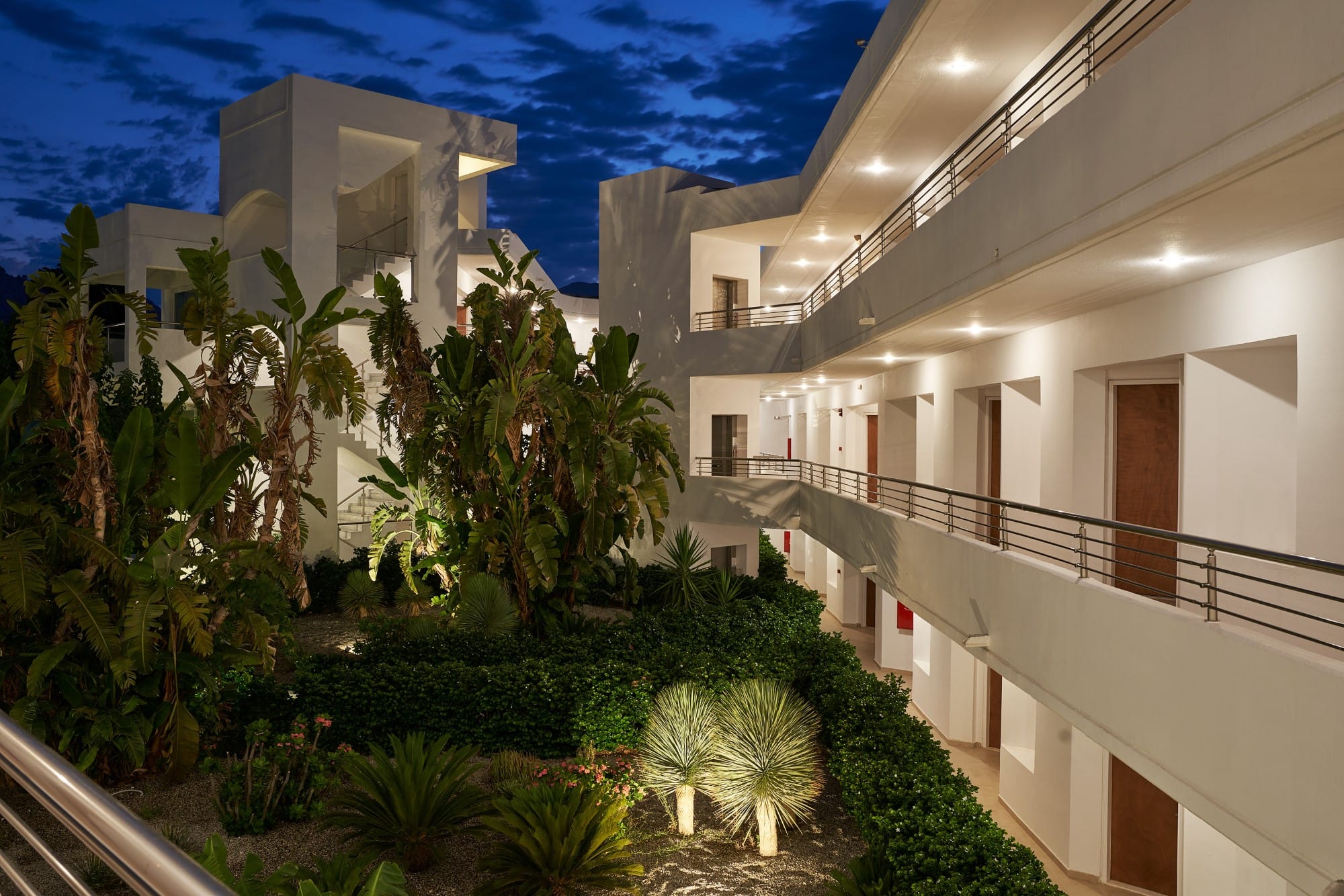 a building with plants and trees