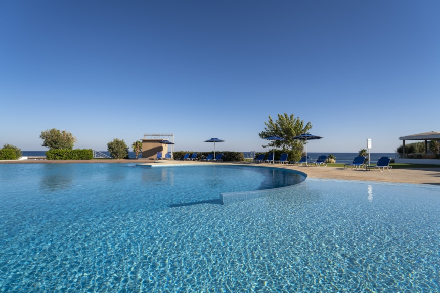 a pool of water with a building in the background