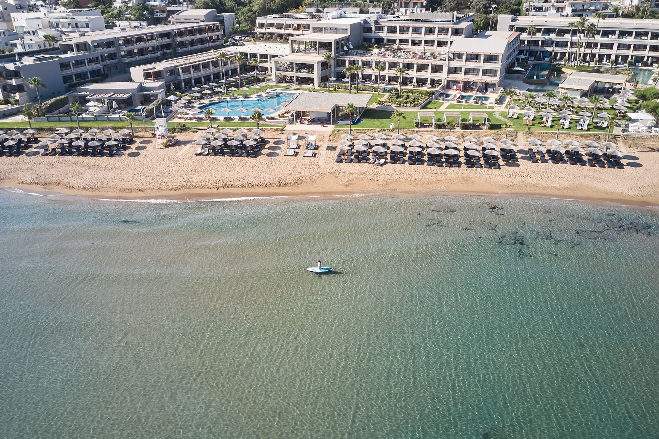 a plane flying over a beach