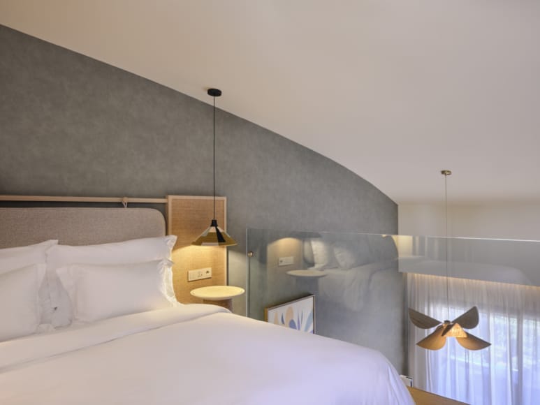 a hotel room with two beds