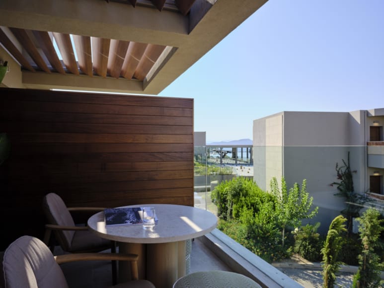 a table and chairs on a balcony