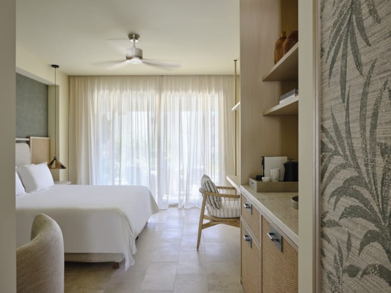 a room with a bed and a desk