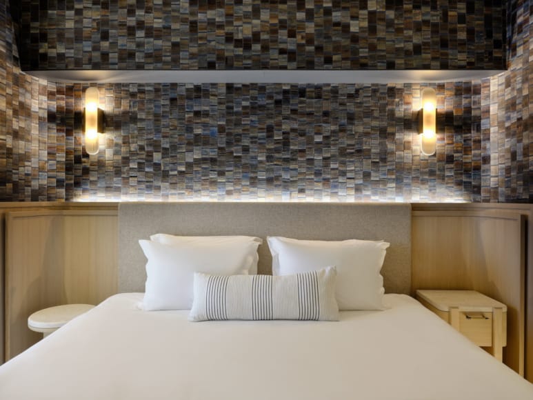 a bed with white pillows