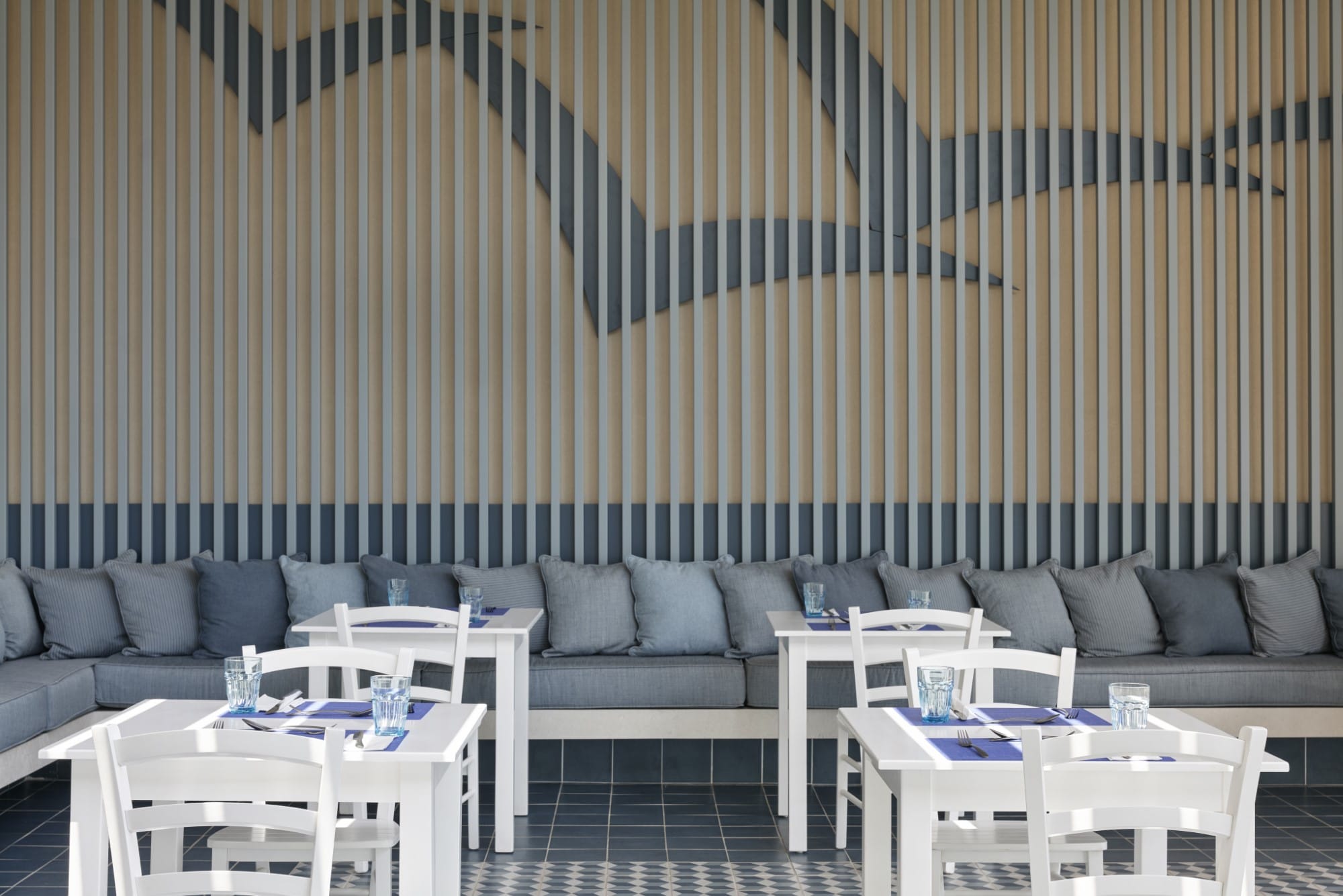 a room with a couch and tables