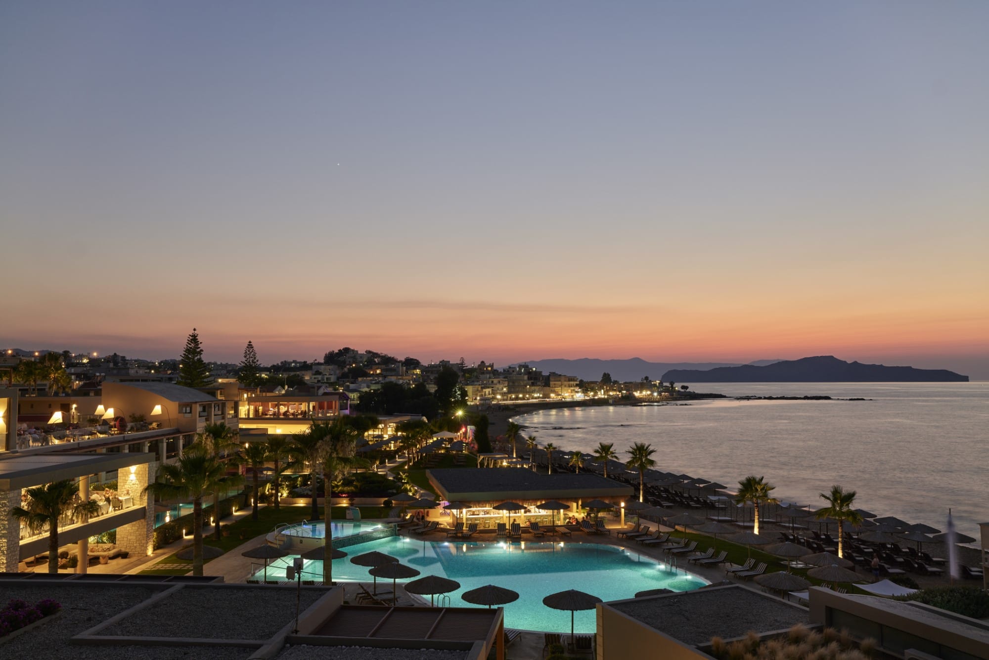 a resort with a pool and a beach