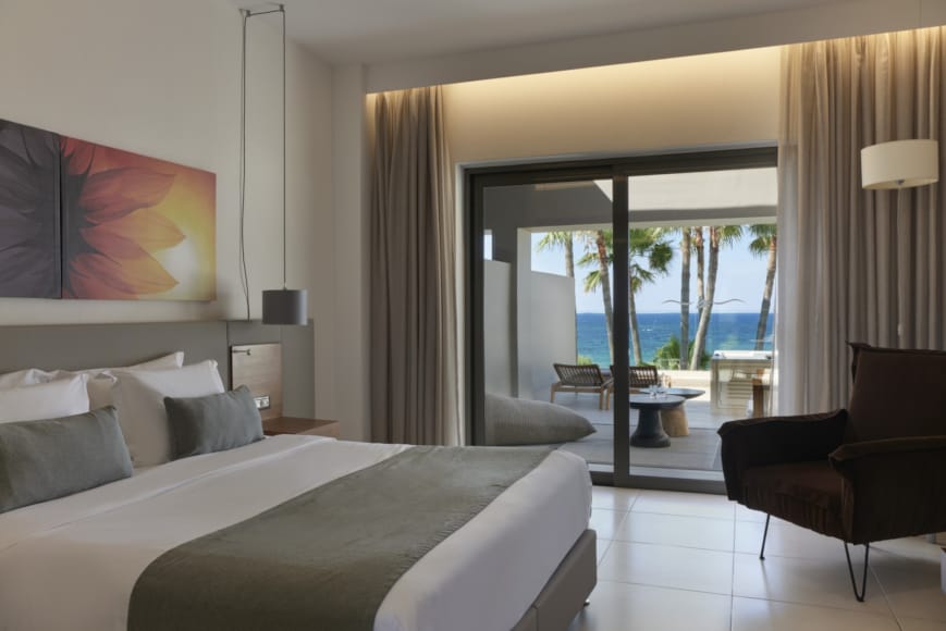 a hotel room with a large glass door