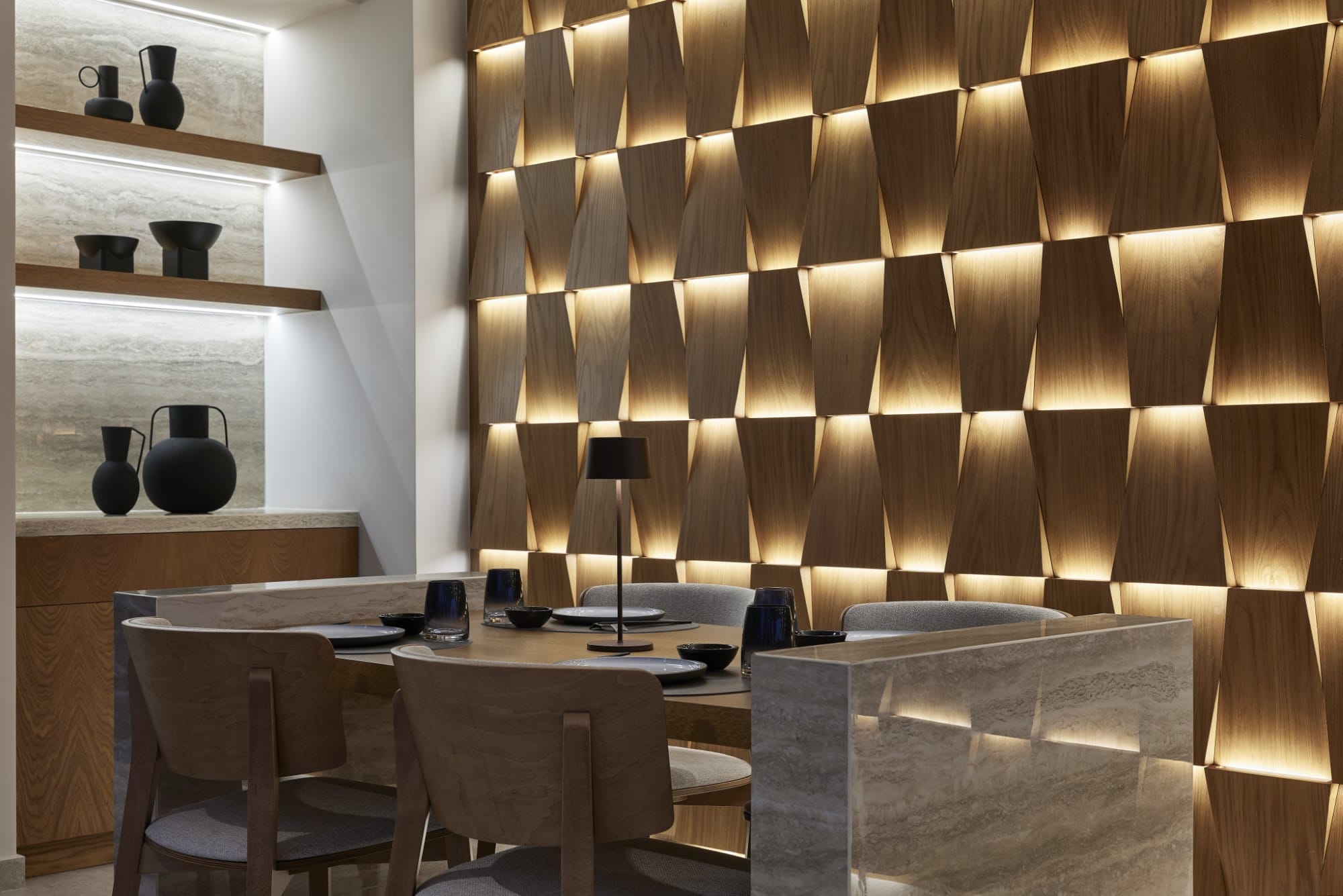 a room with a desk and chairs