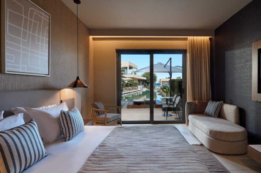 a bedroom with a large window