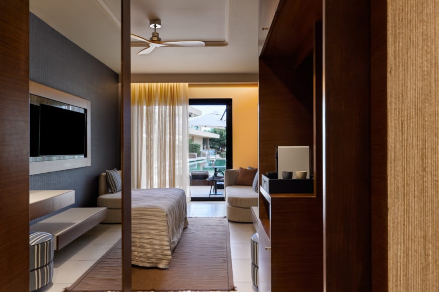 a room with a bed and a tv