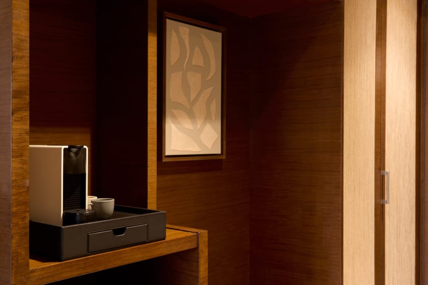 a kitchen with a painting on the wall