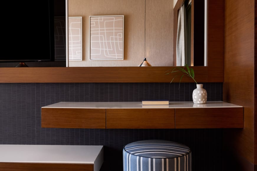 a vase with a plant on a shelf