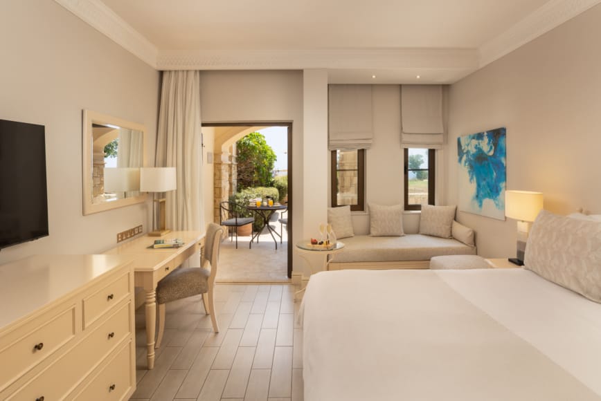 a room with a bed and a tv