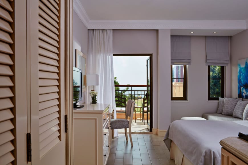 a bedroom with a large glass door