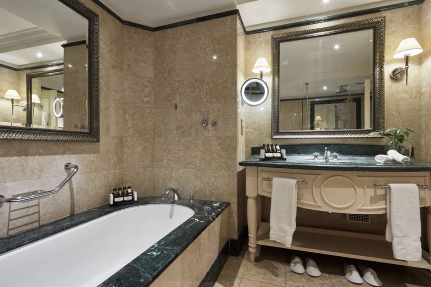 a bathroom with a tub and sink
