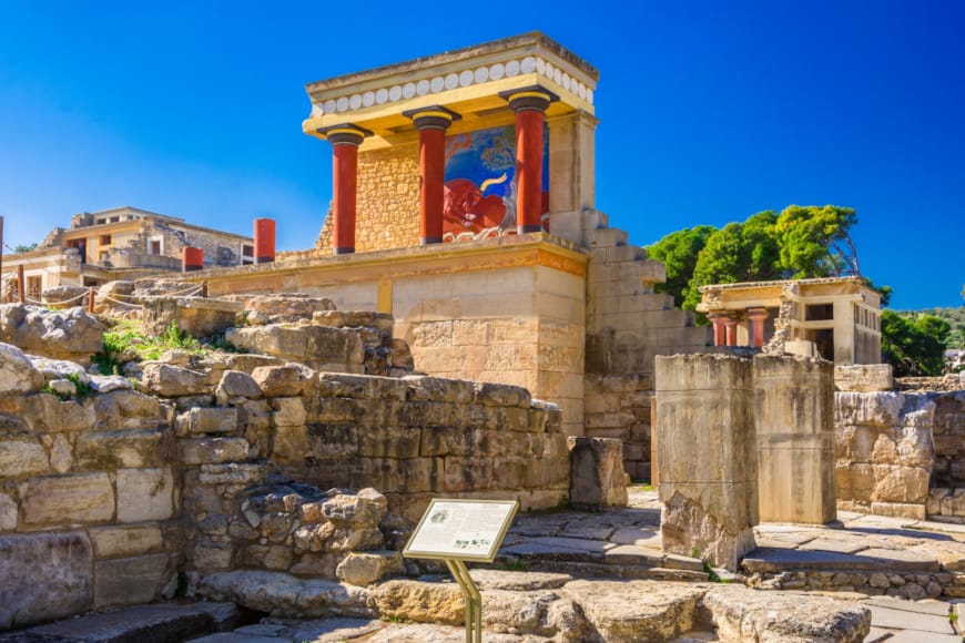 Knossos with a sign in front of it