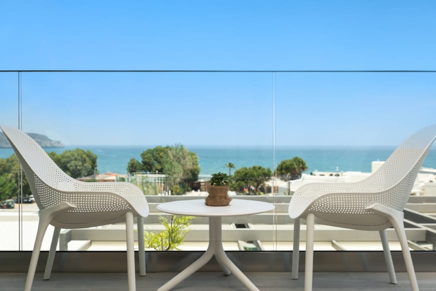 a table and chairs on a balcony