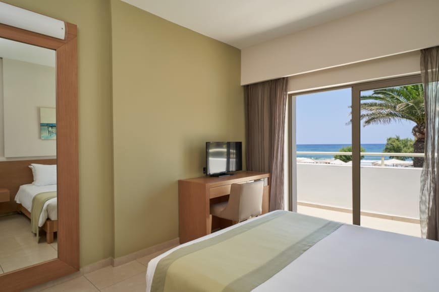 a hotel room with a view of the ocean
