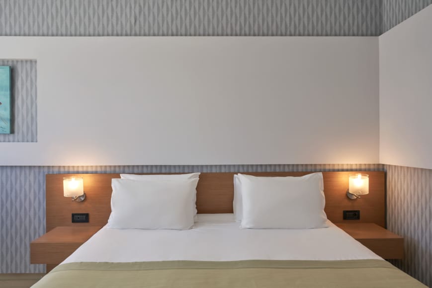 a bed with white pillows