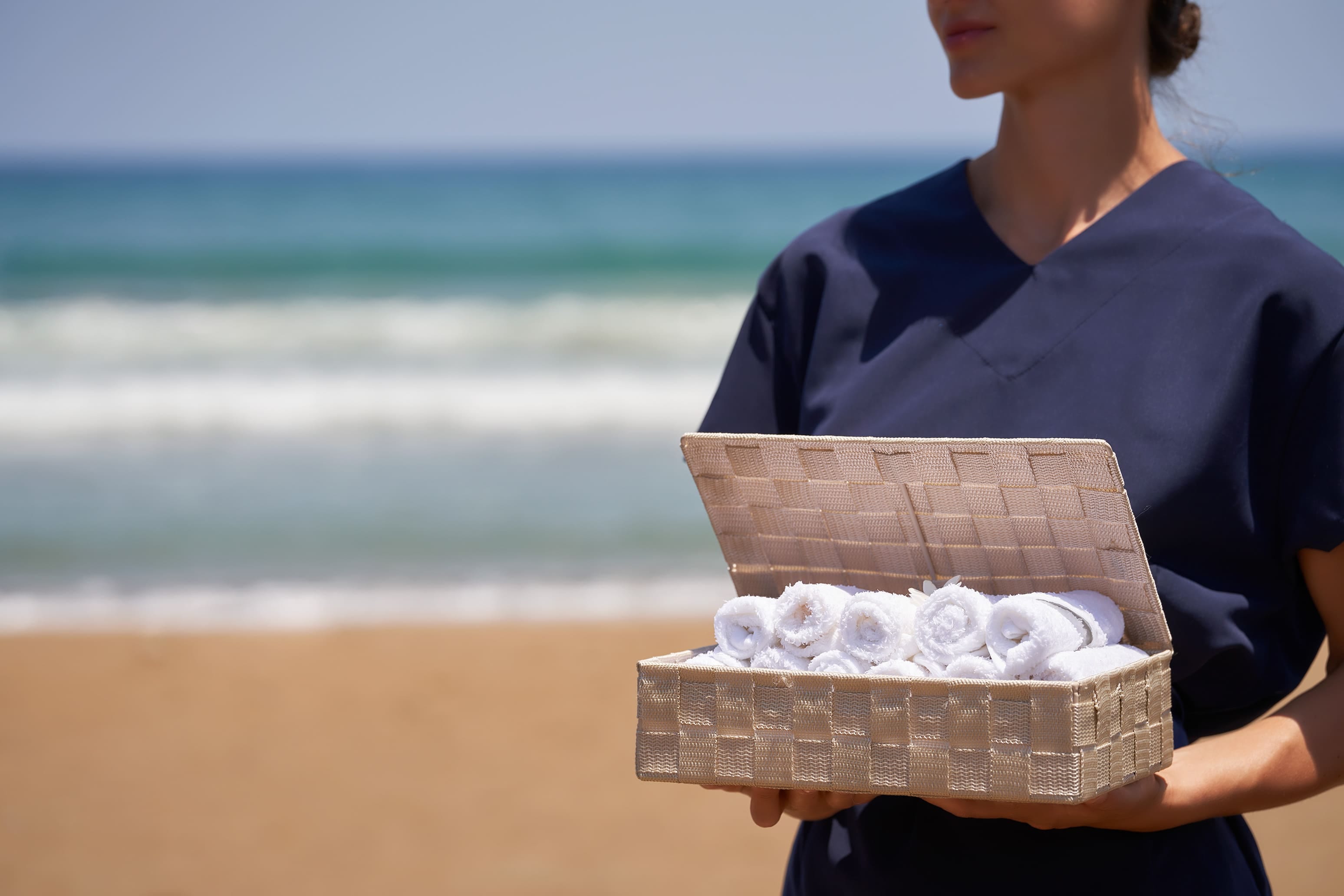a person holding a basket of tissues