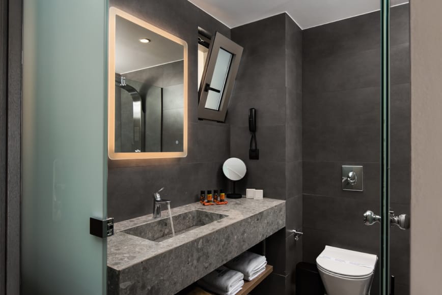 a bathroom with a marble countertop