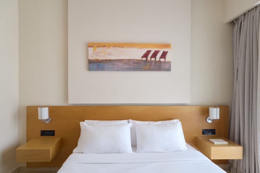 a bed with white sheets