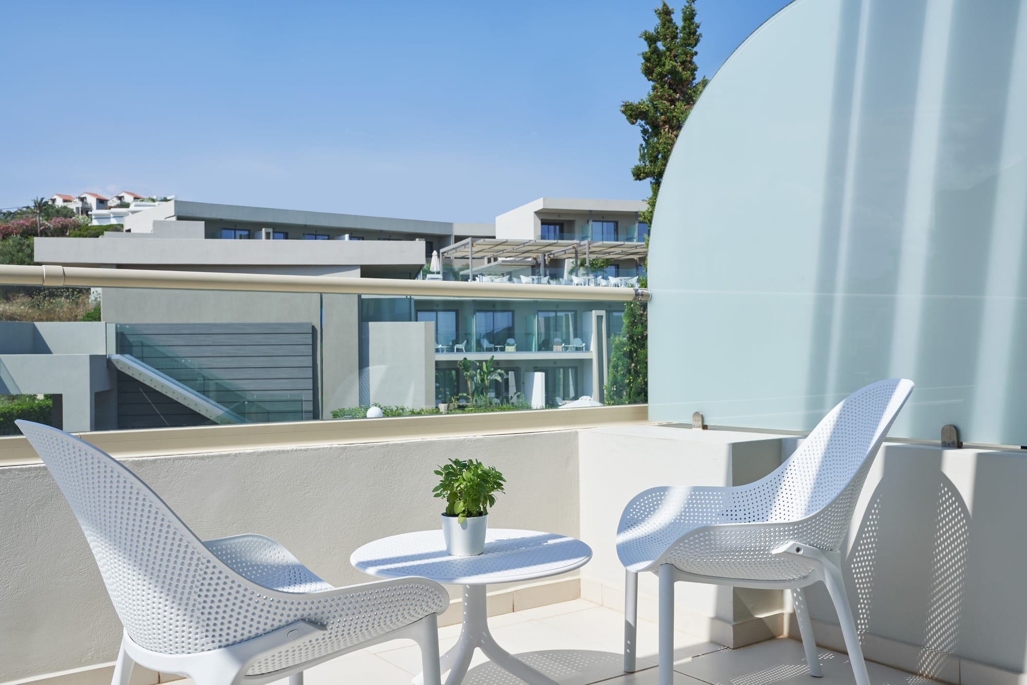 a patio with a table and chairs