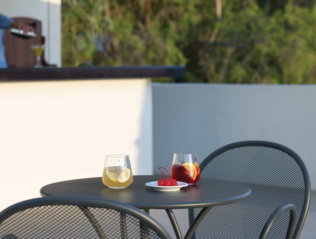 a table with glasses and a candle on it