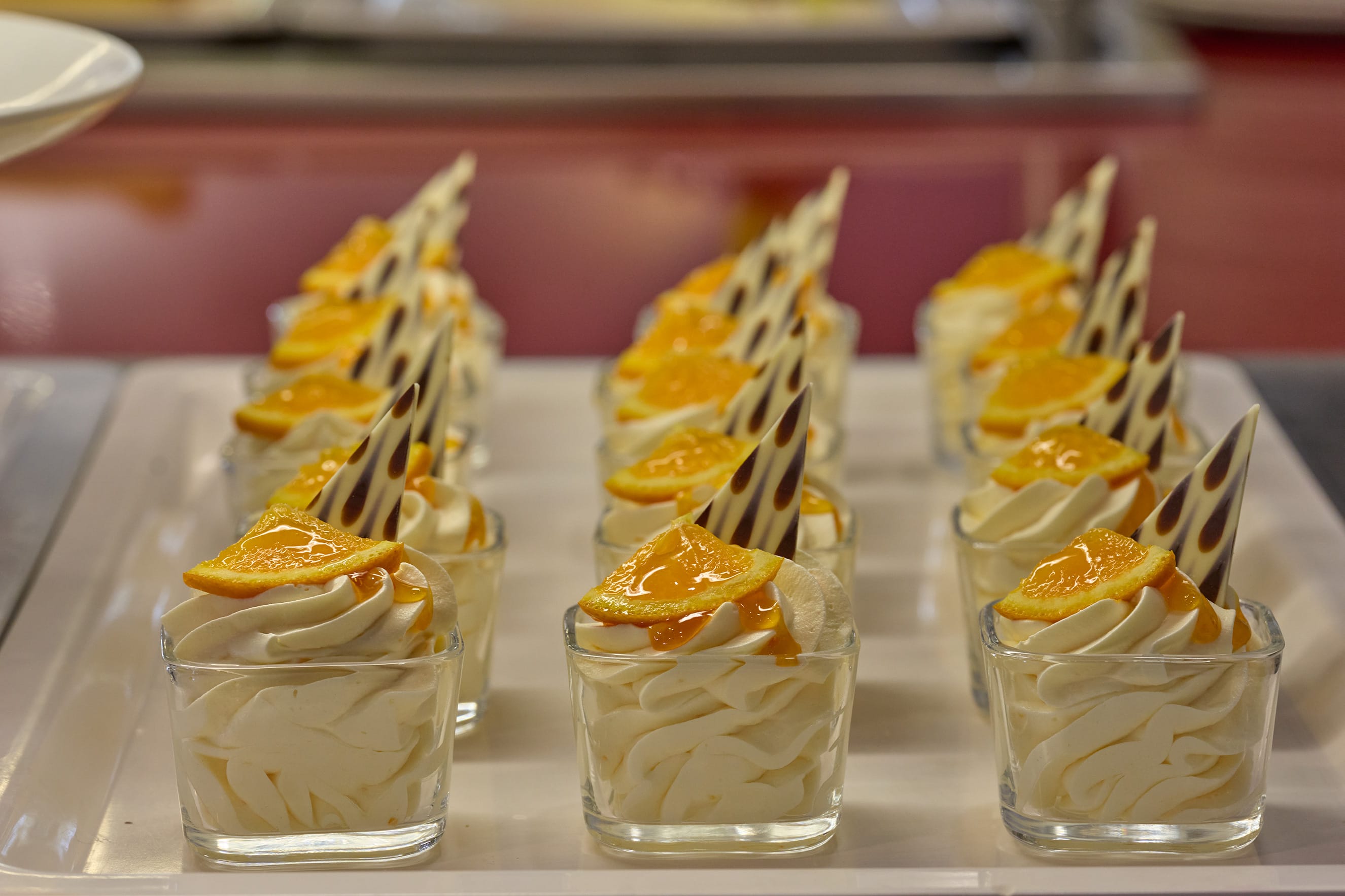 a group of glasses with ice cream in them