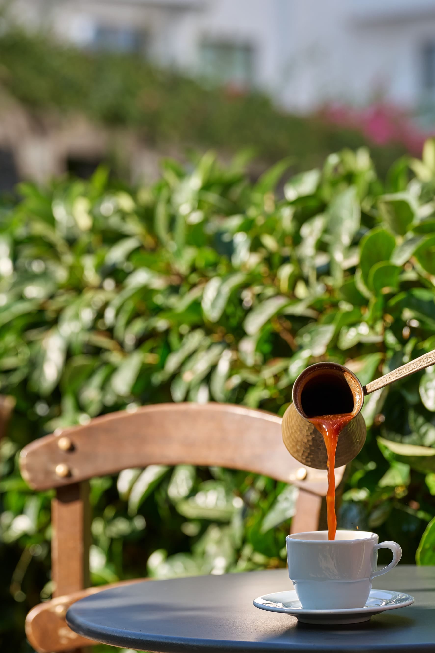 a cup of coffee and a spoon on a table