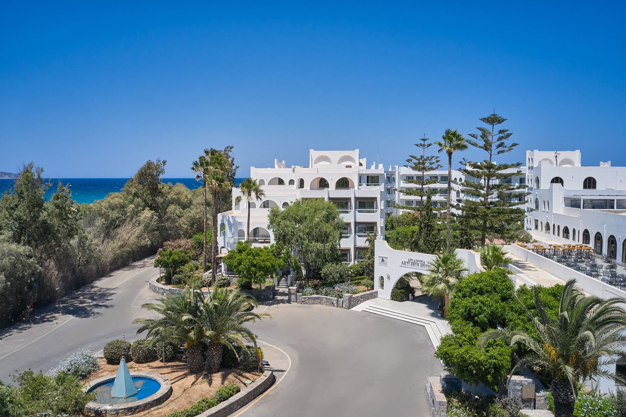 a building with trees and a pool
