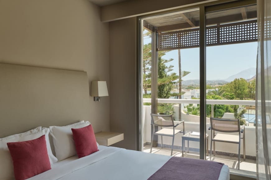 a bedroom with a large window