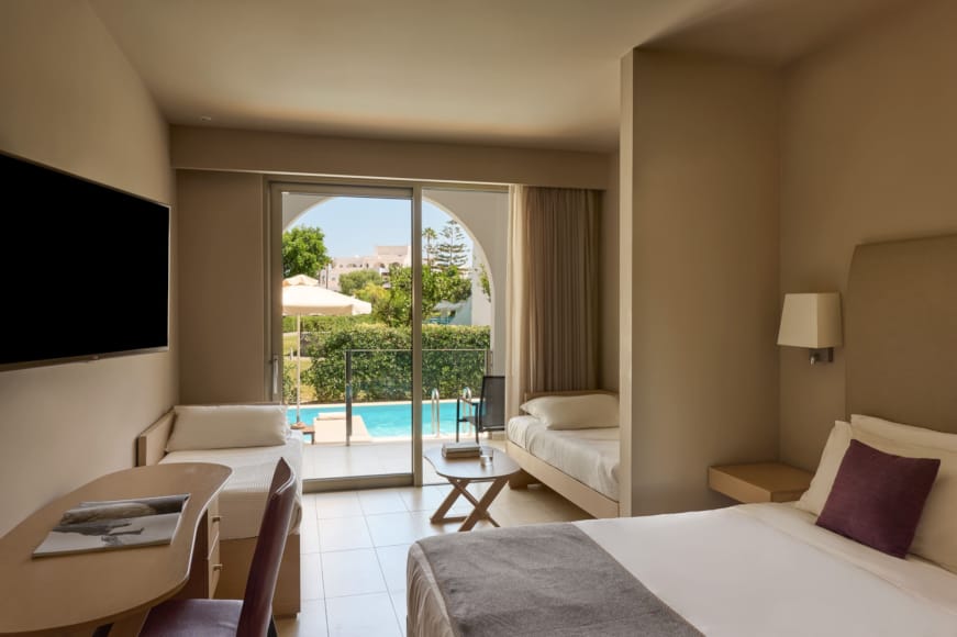 a bedroom with a large balcony