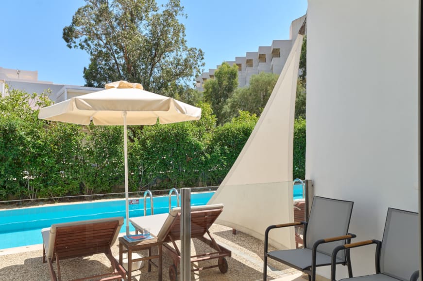 a deck with chairs and umbrellas