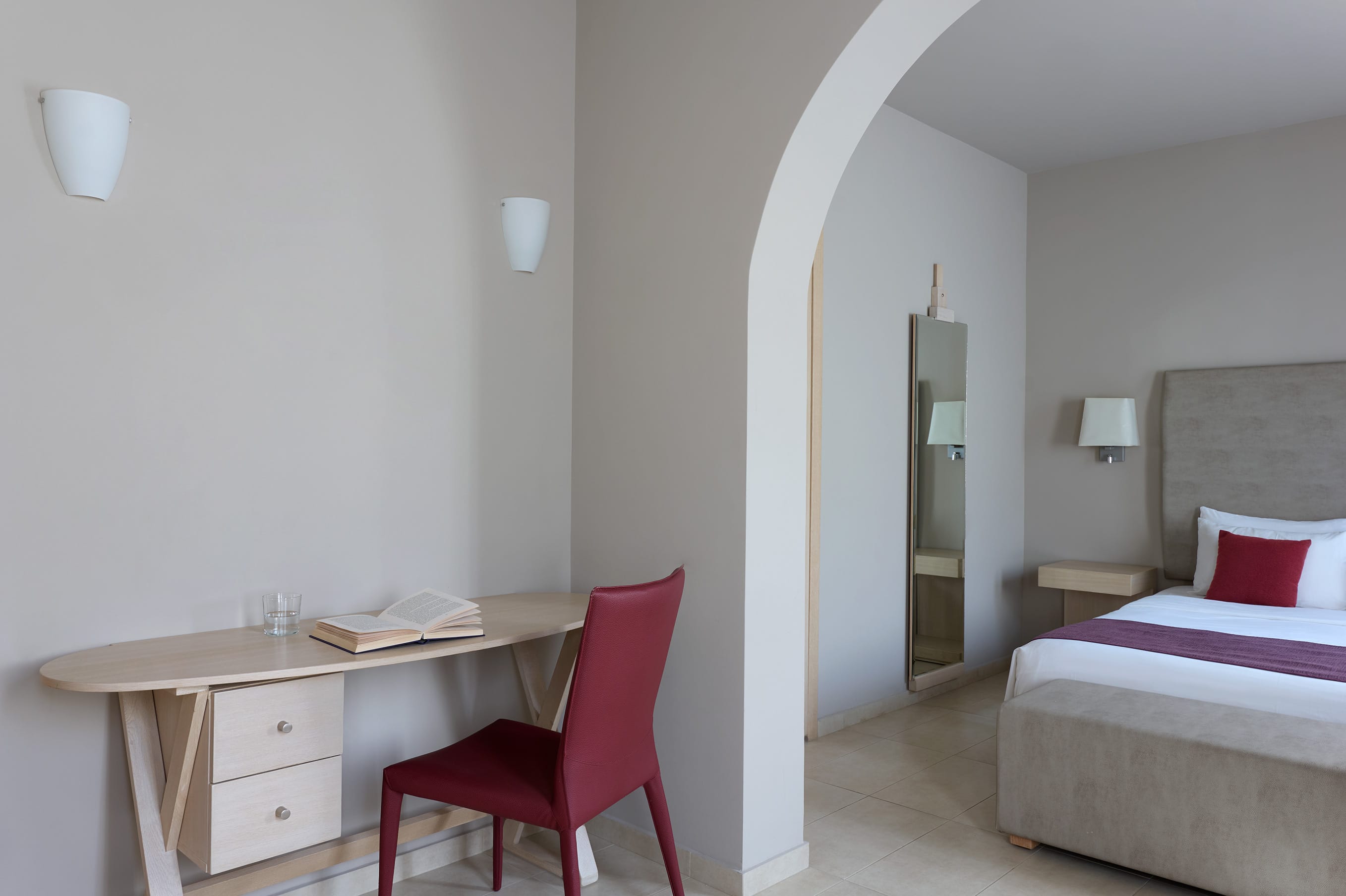 a room with a bed and a desk