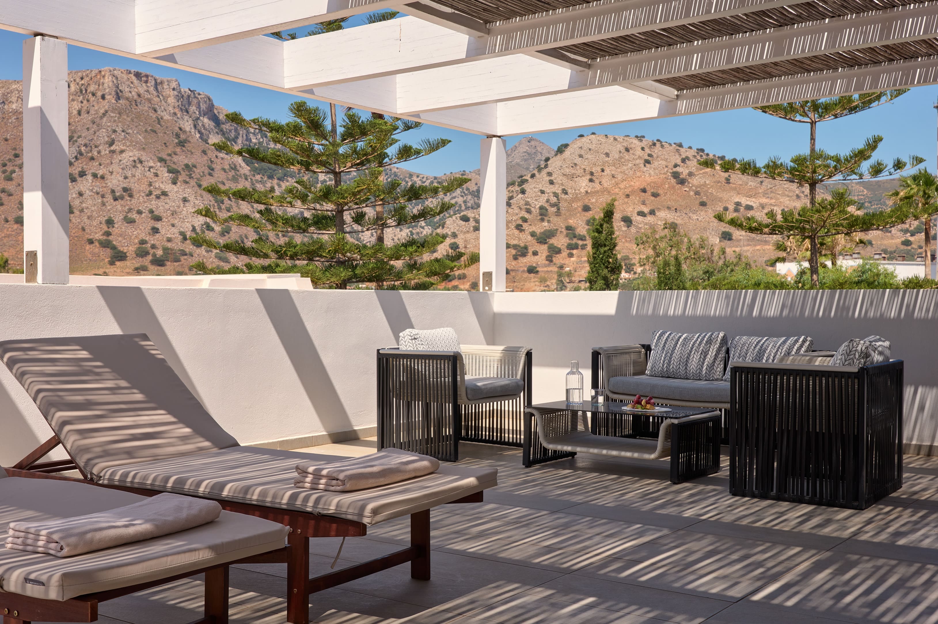 a patio with chairs and tables