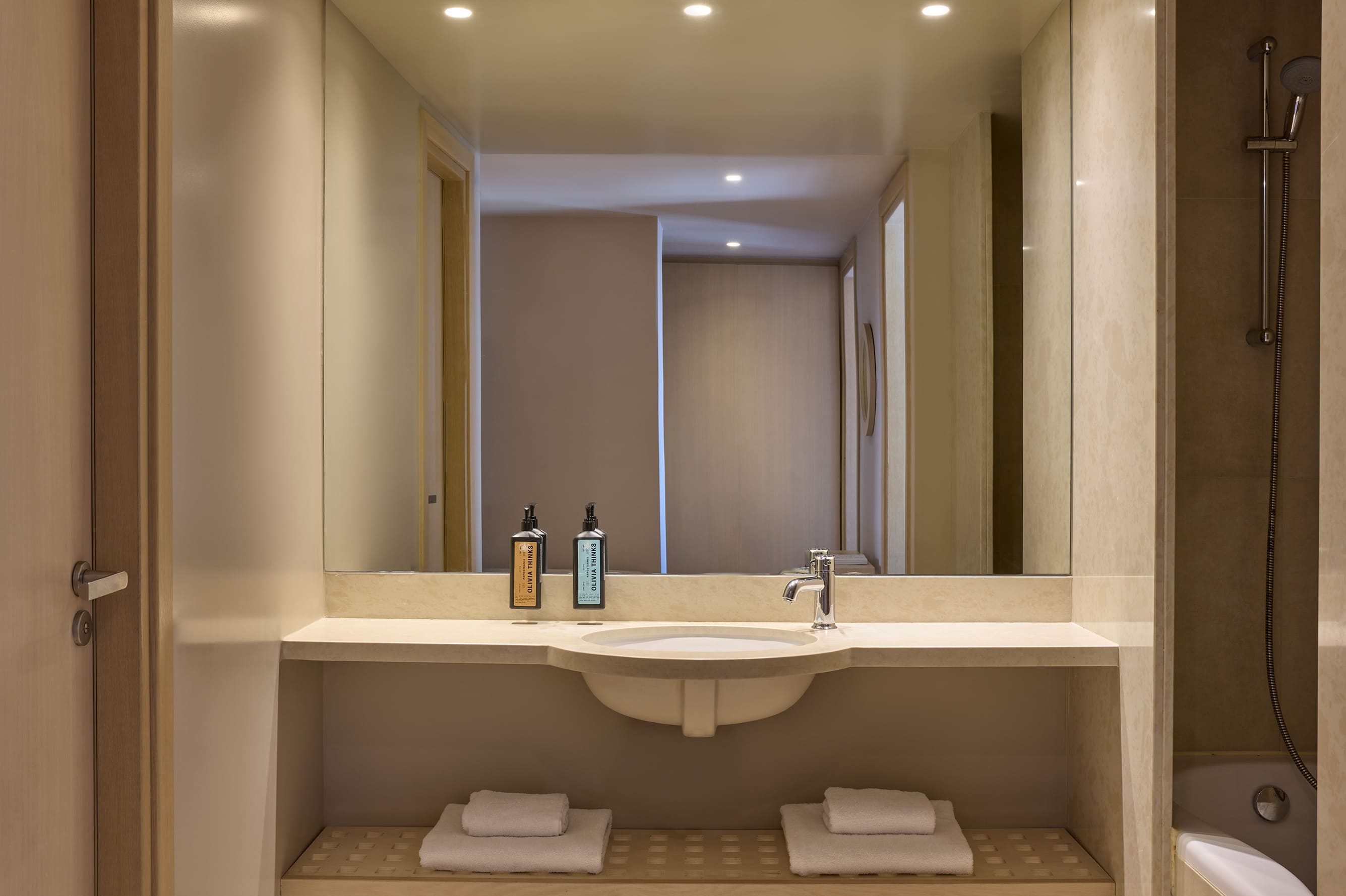 a bathroom with a large mirror