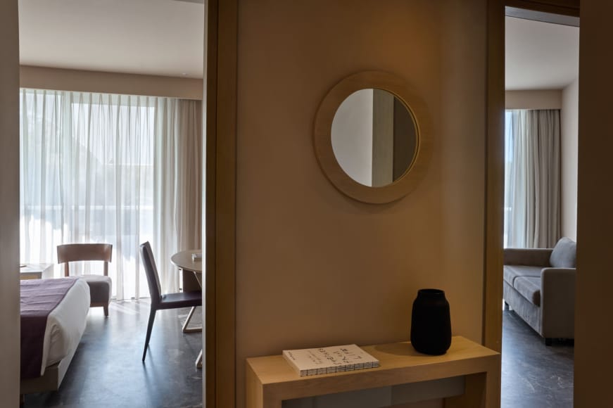 a room with a desk and a mirror
