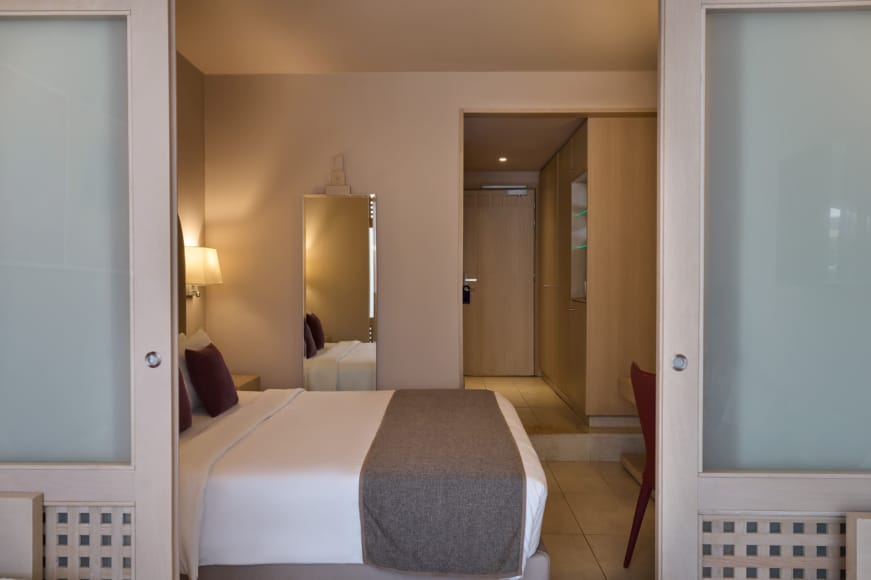 a bedroom with a bed and a couch