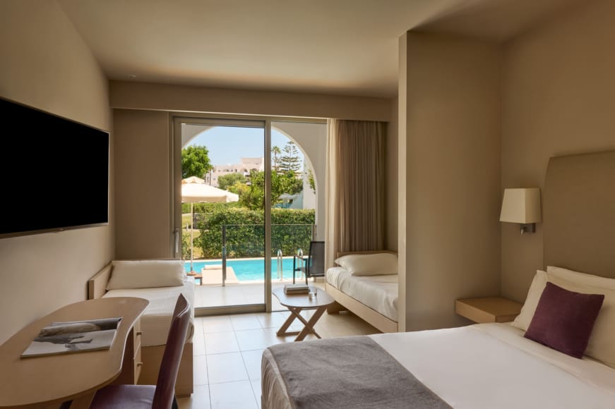 a bedroom with a large balcony