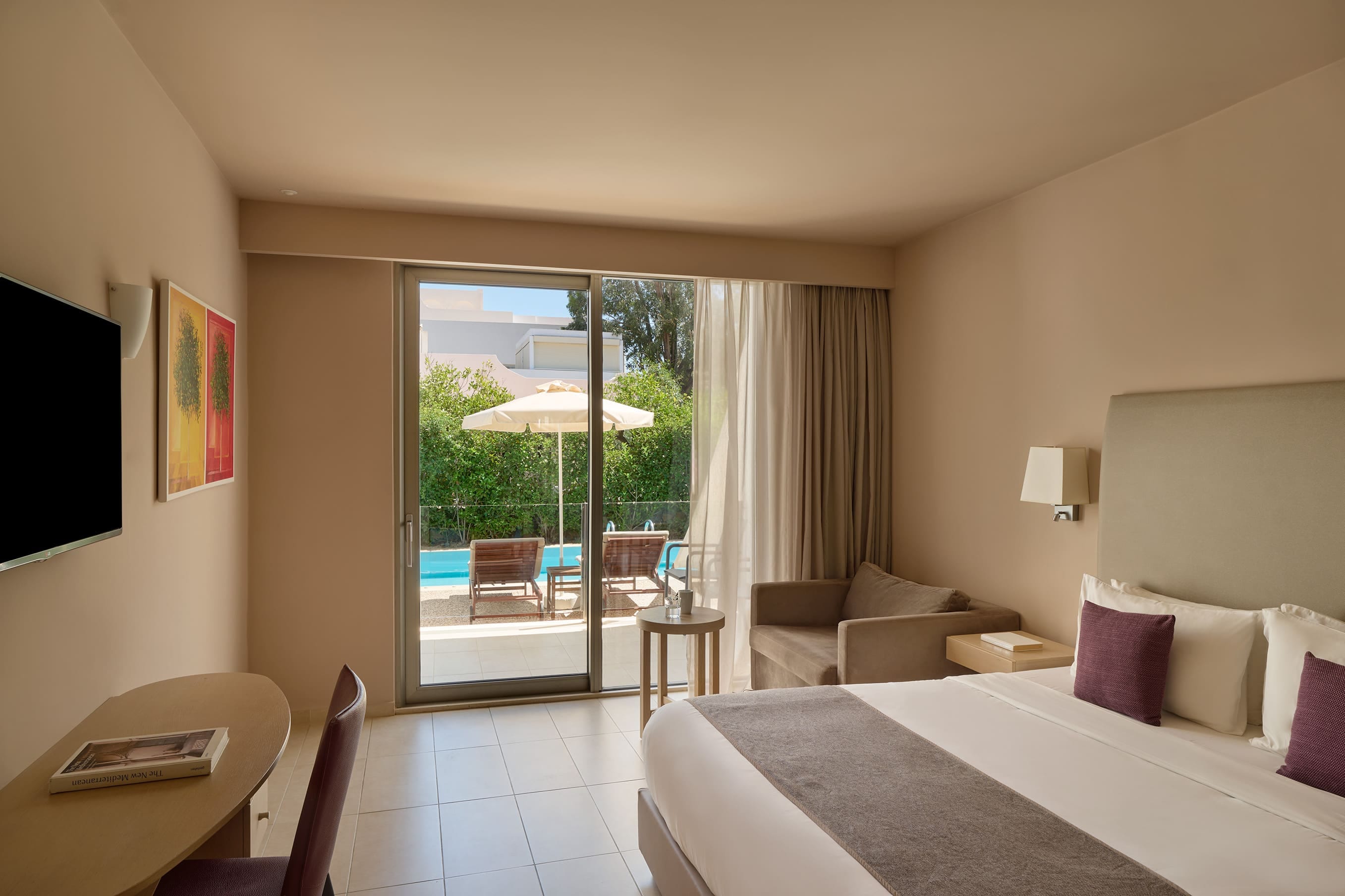 a bedroom with a large glass door