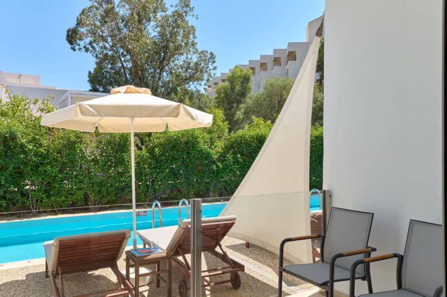 a deck with chairs and umbrellas