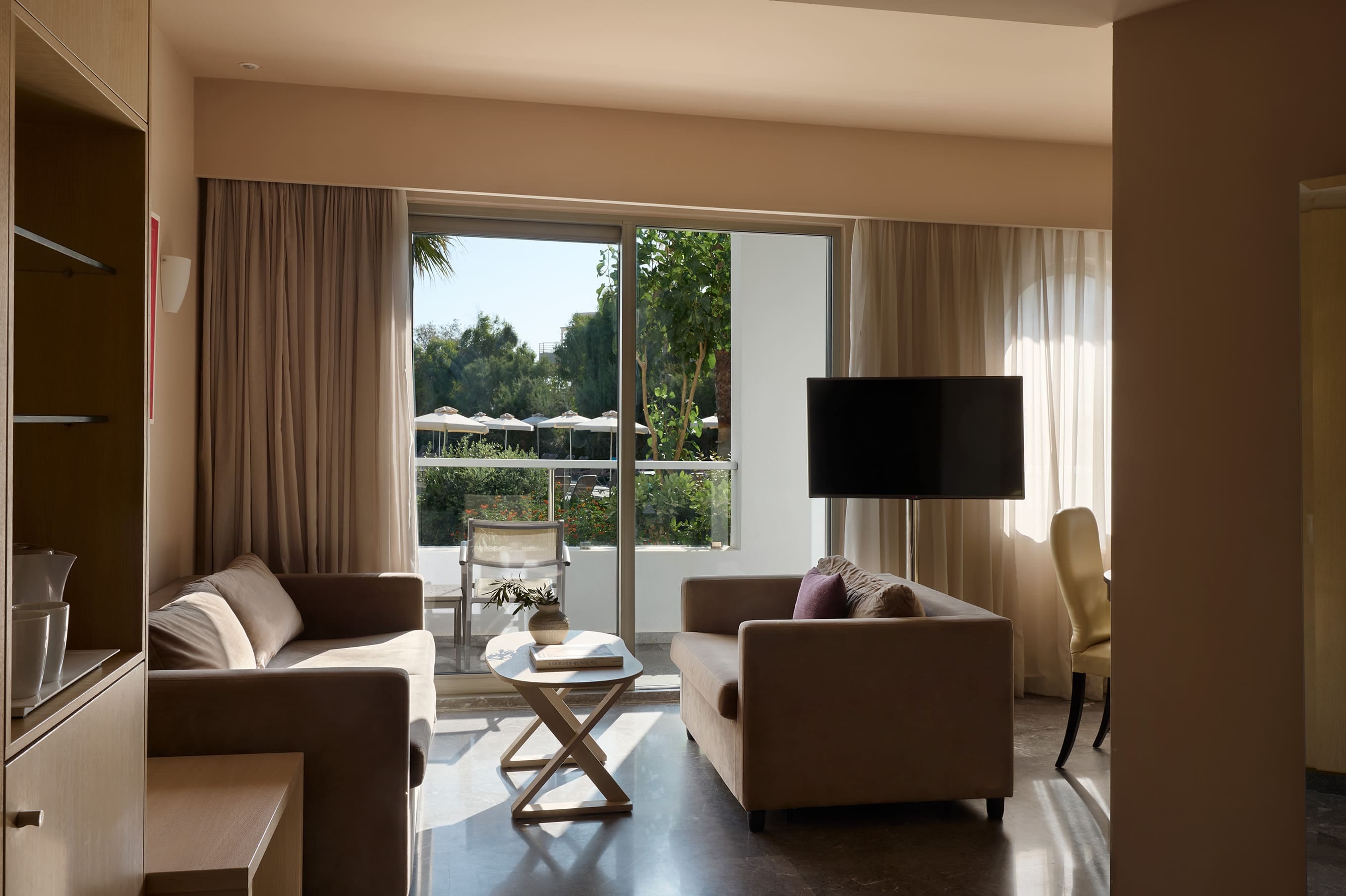 a living room with a tv and couches