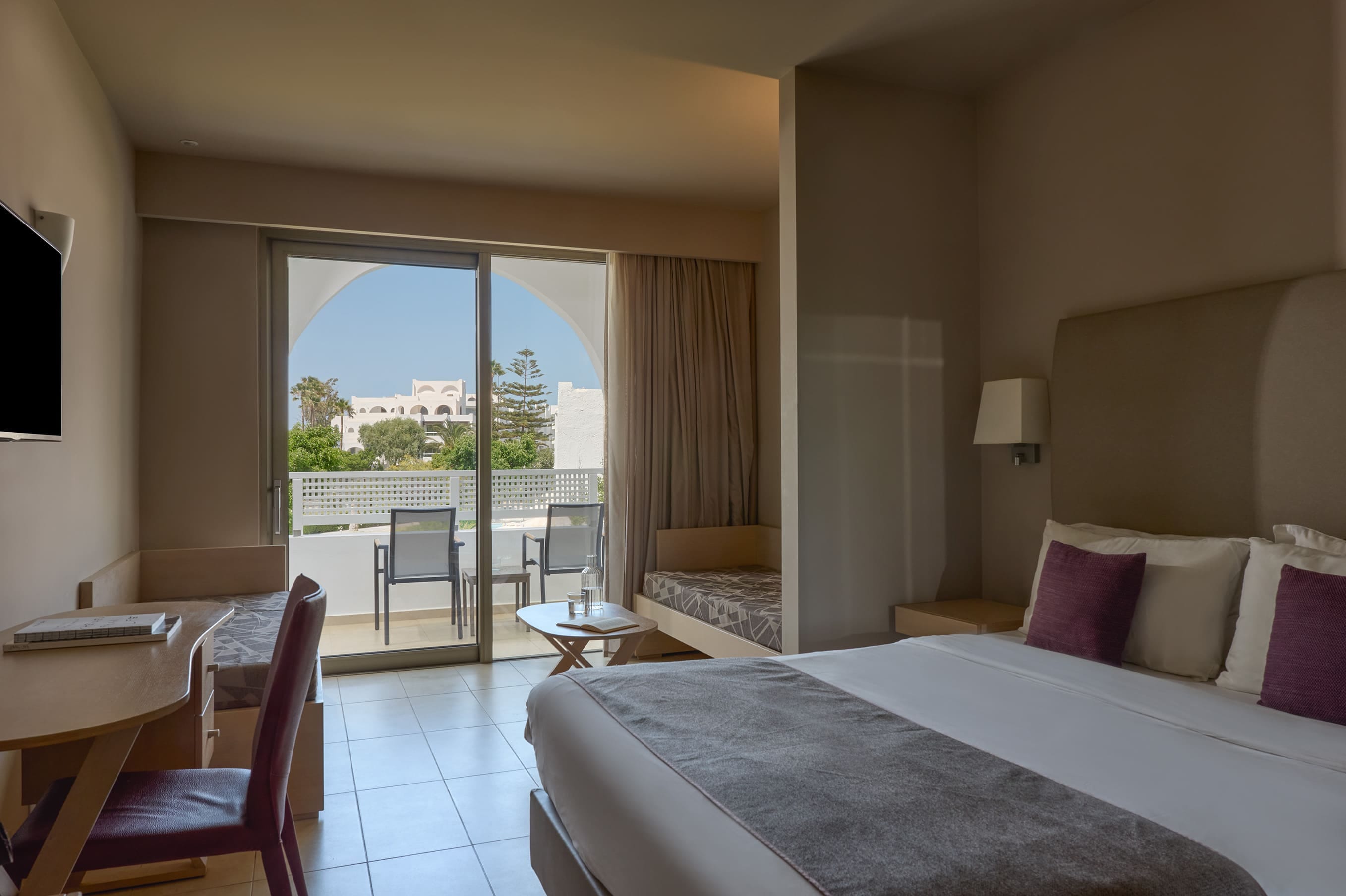 a bedroom with a large window