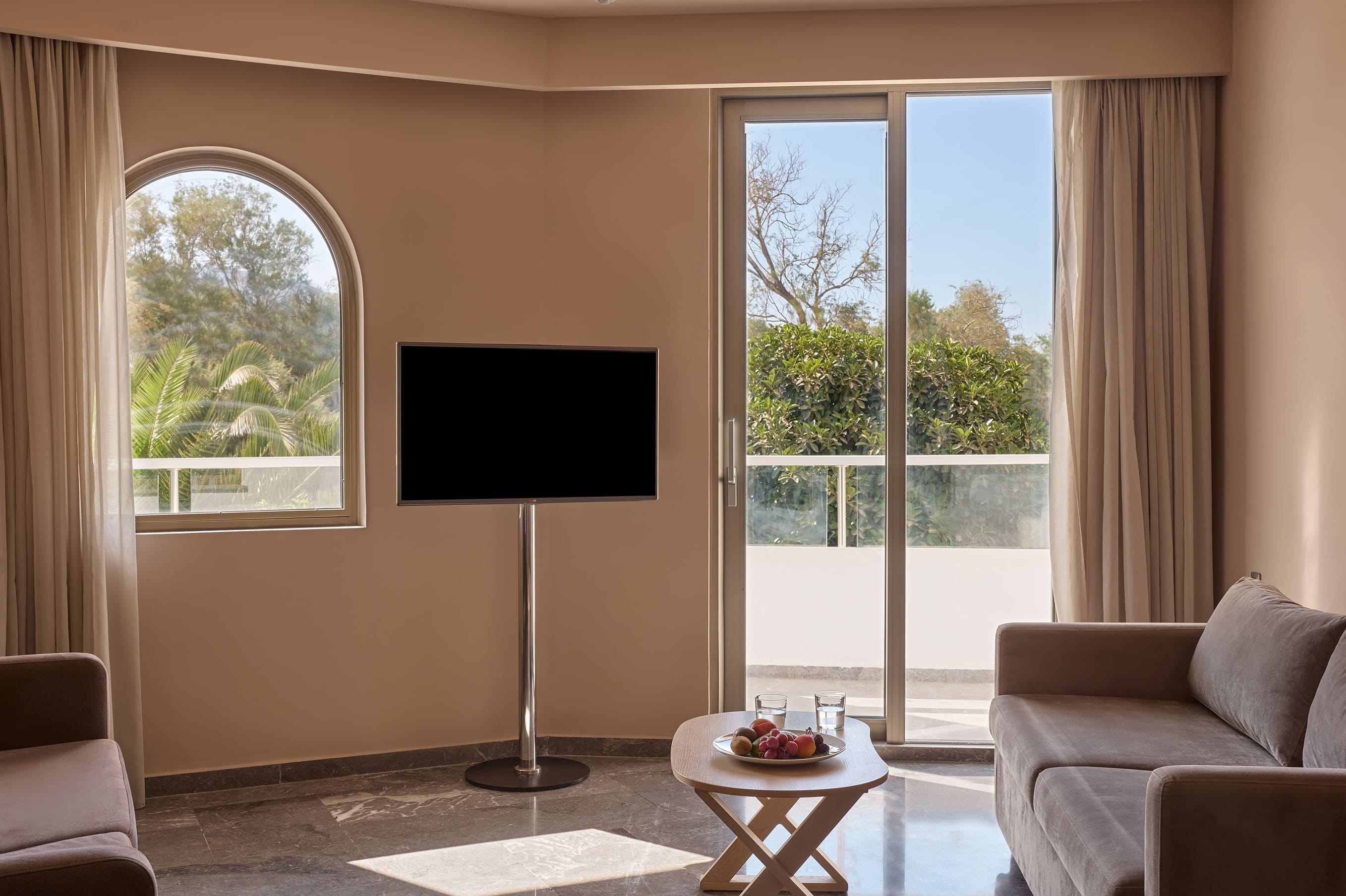 a living room with a tv and a table