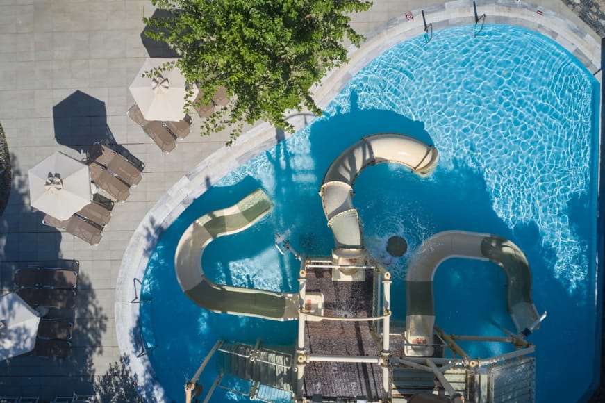 a tall tower with a tree in the background