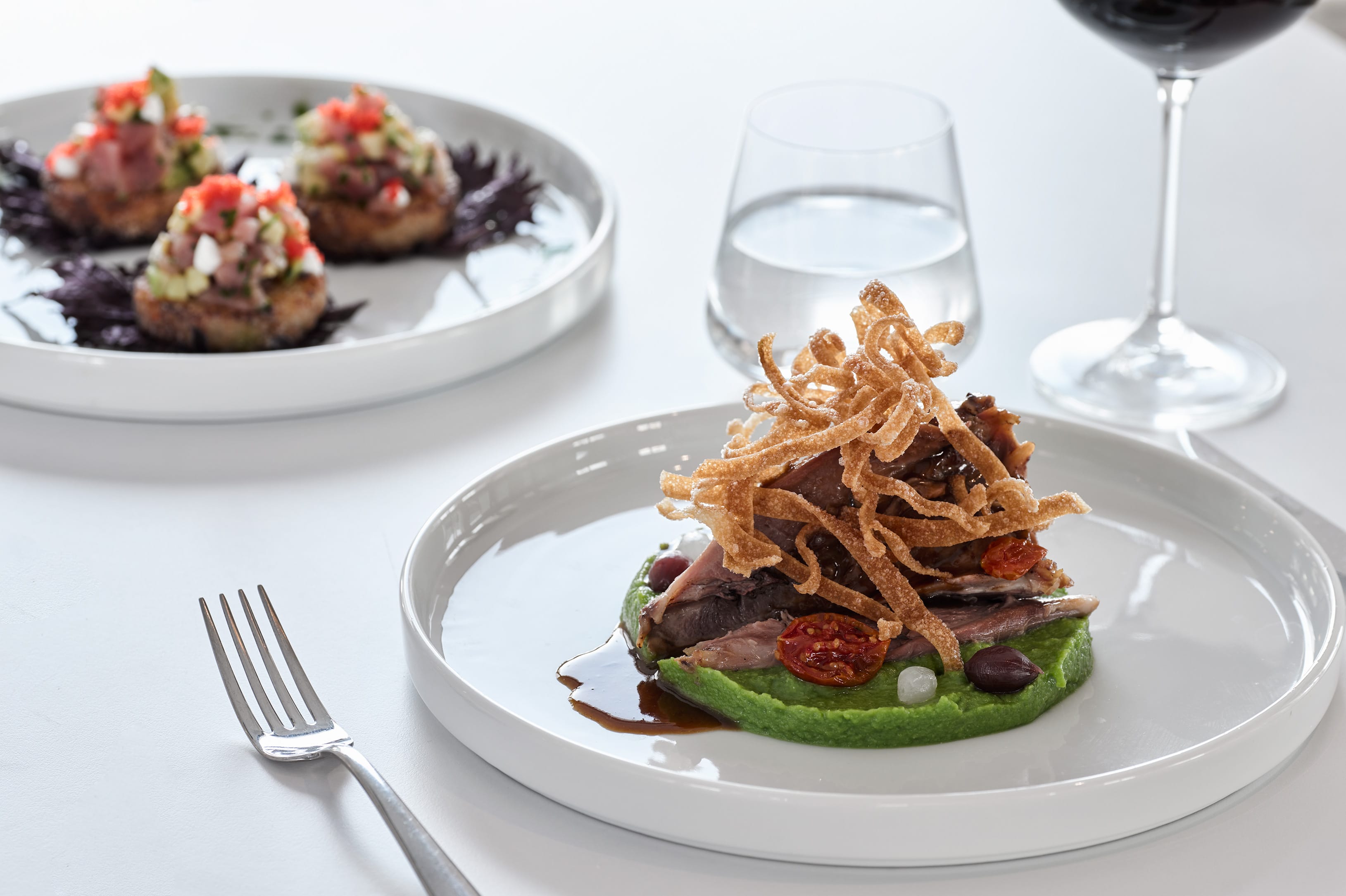 a plate of food and glasses