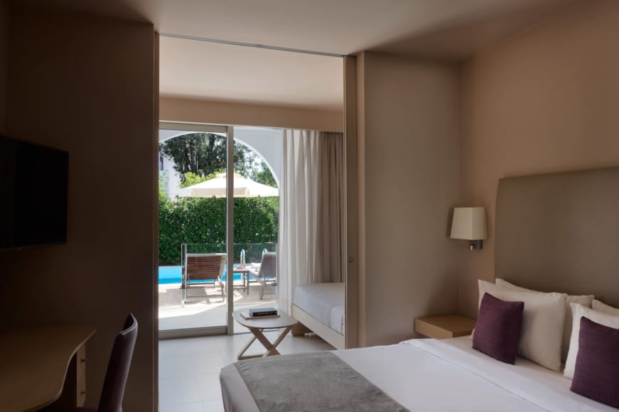 a bedroom with a large window