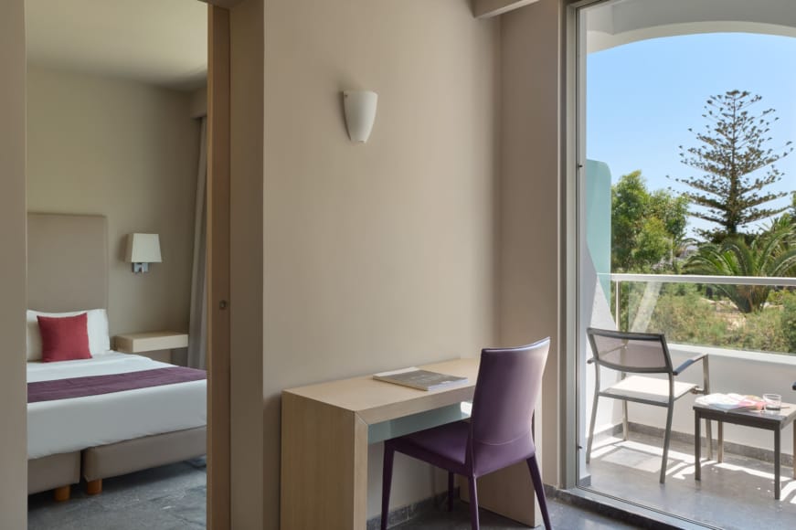 a room with a bed and desk